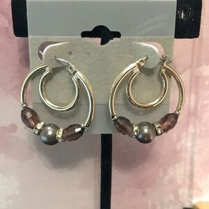 Gold tone earrings with purple and grey stones